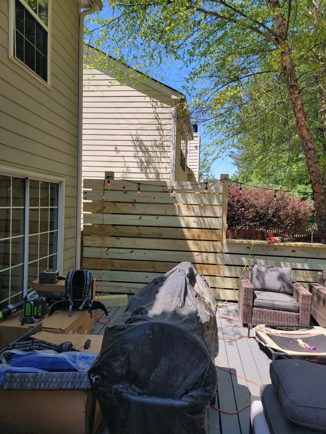 Wood privacy wall and patio zone under construction
