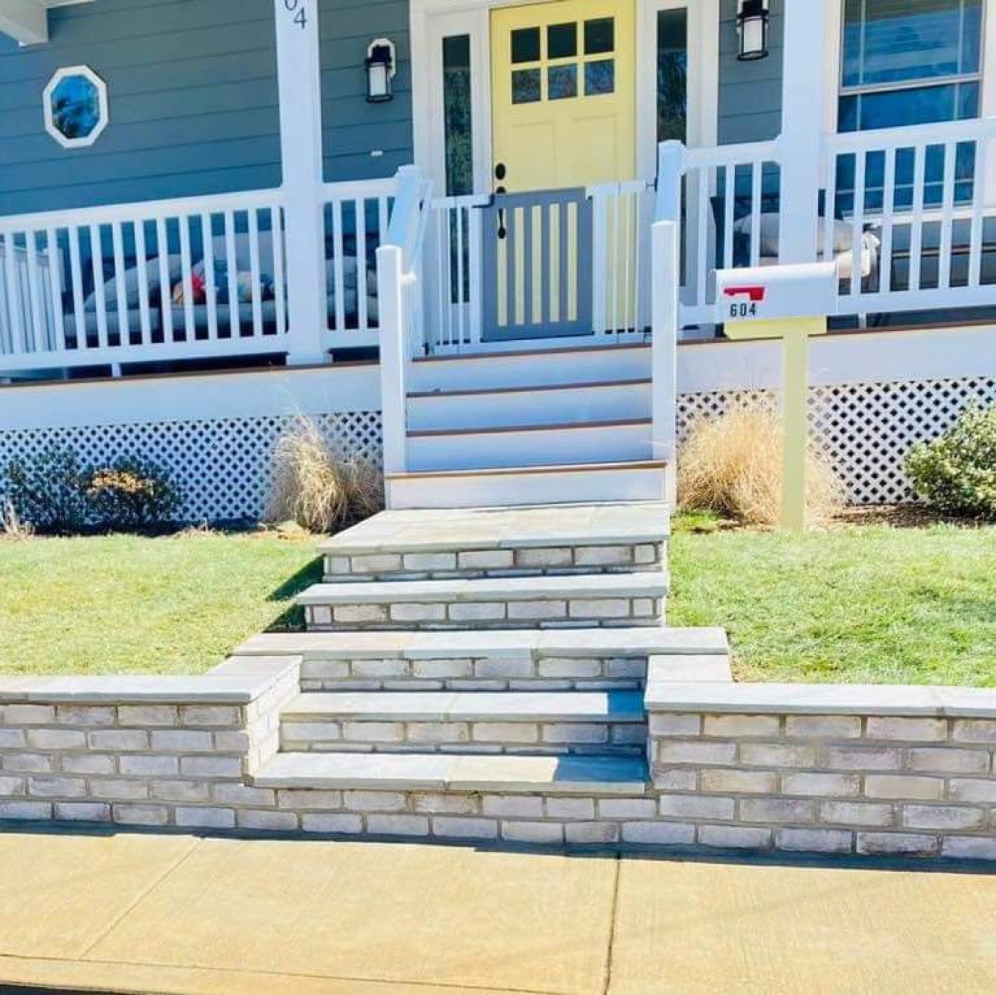 Front entry stone steps and low retaining wall
