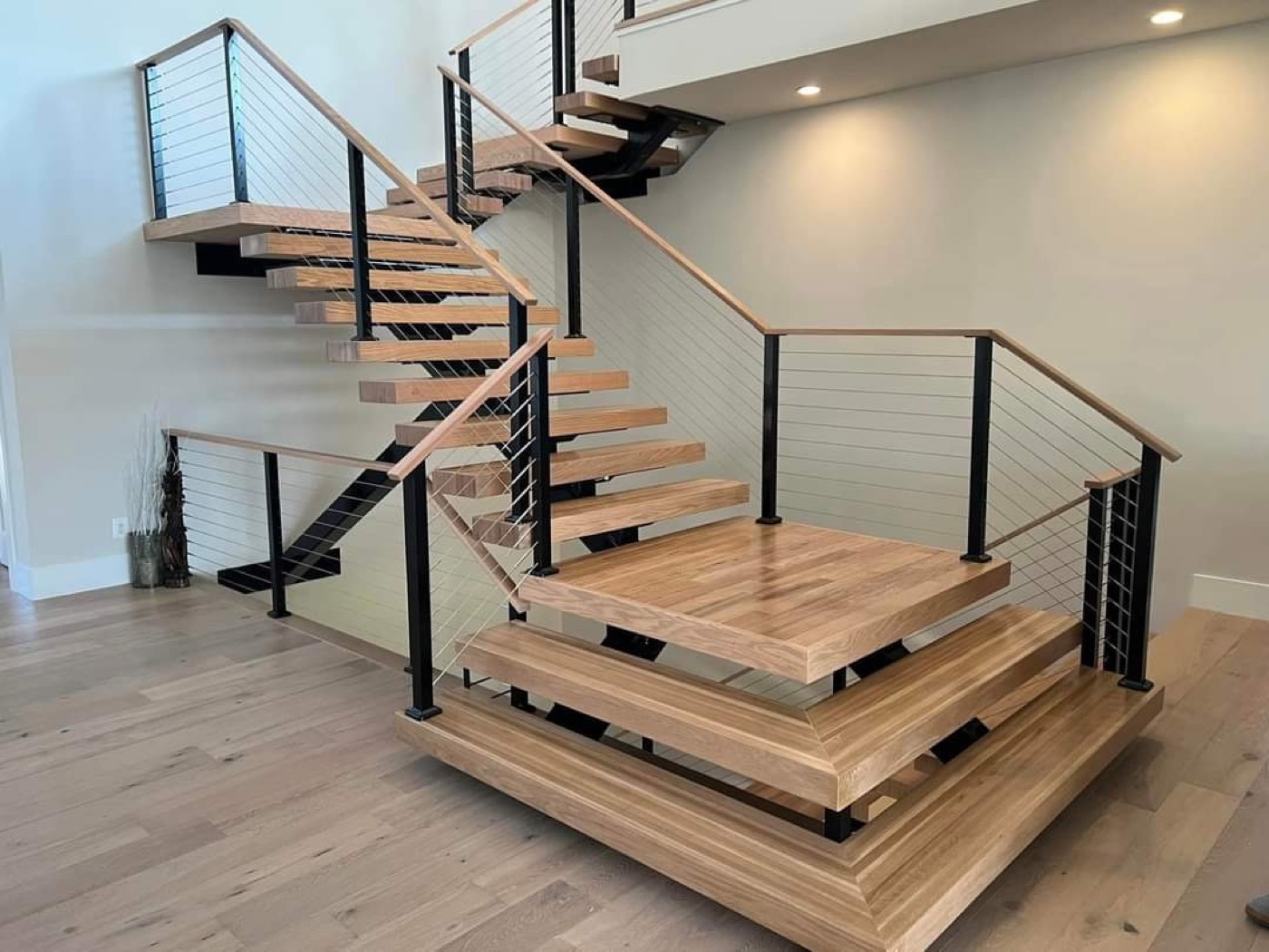 Multi-level floating staircase with cable railings
