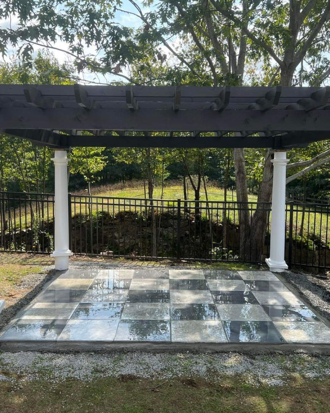 Pergola over stone paver pad with columns