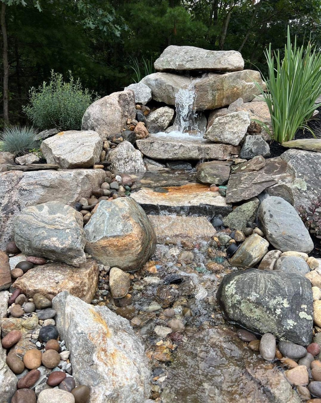 Natural rock waterfall and water feature