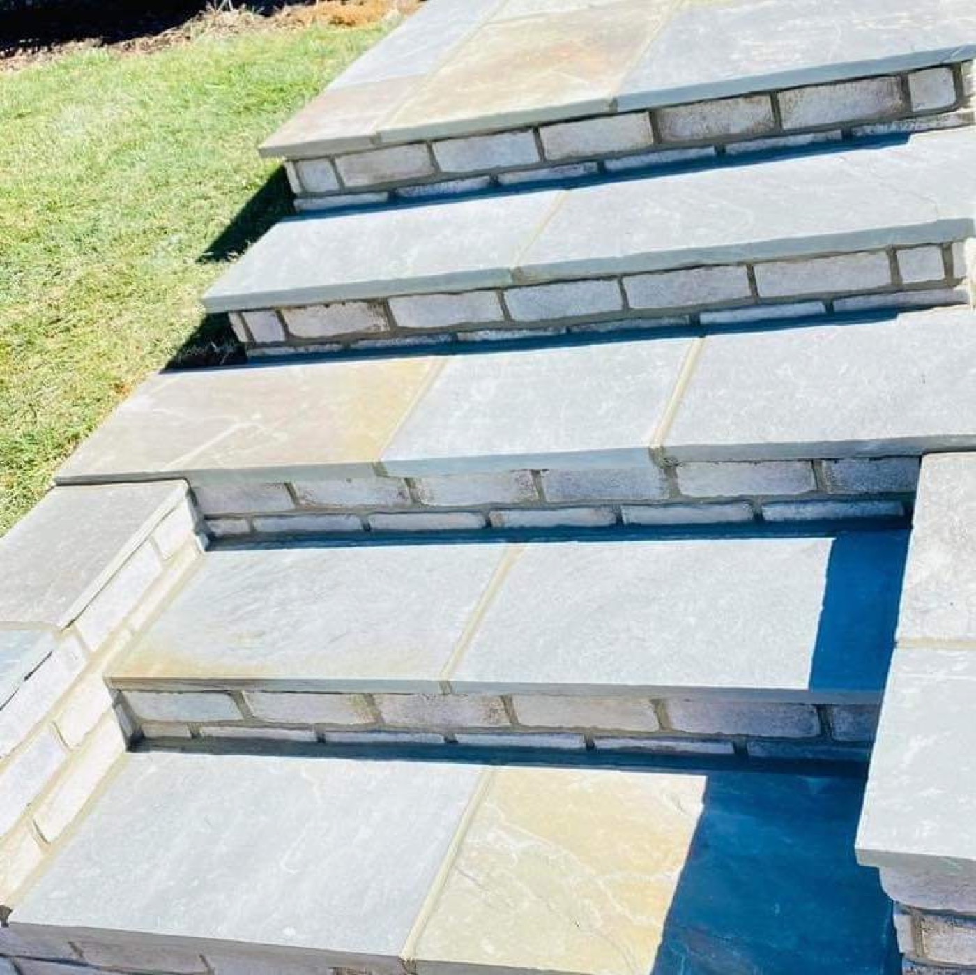 Stone step treads with masonry risers