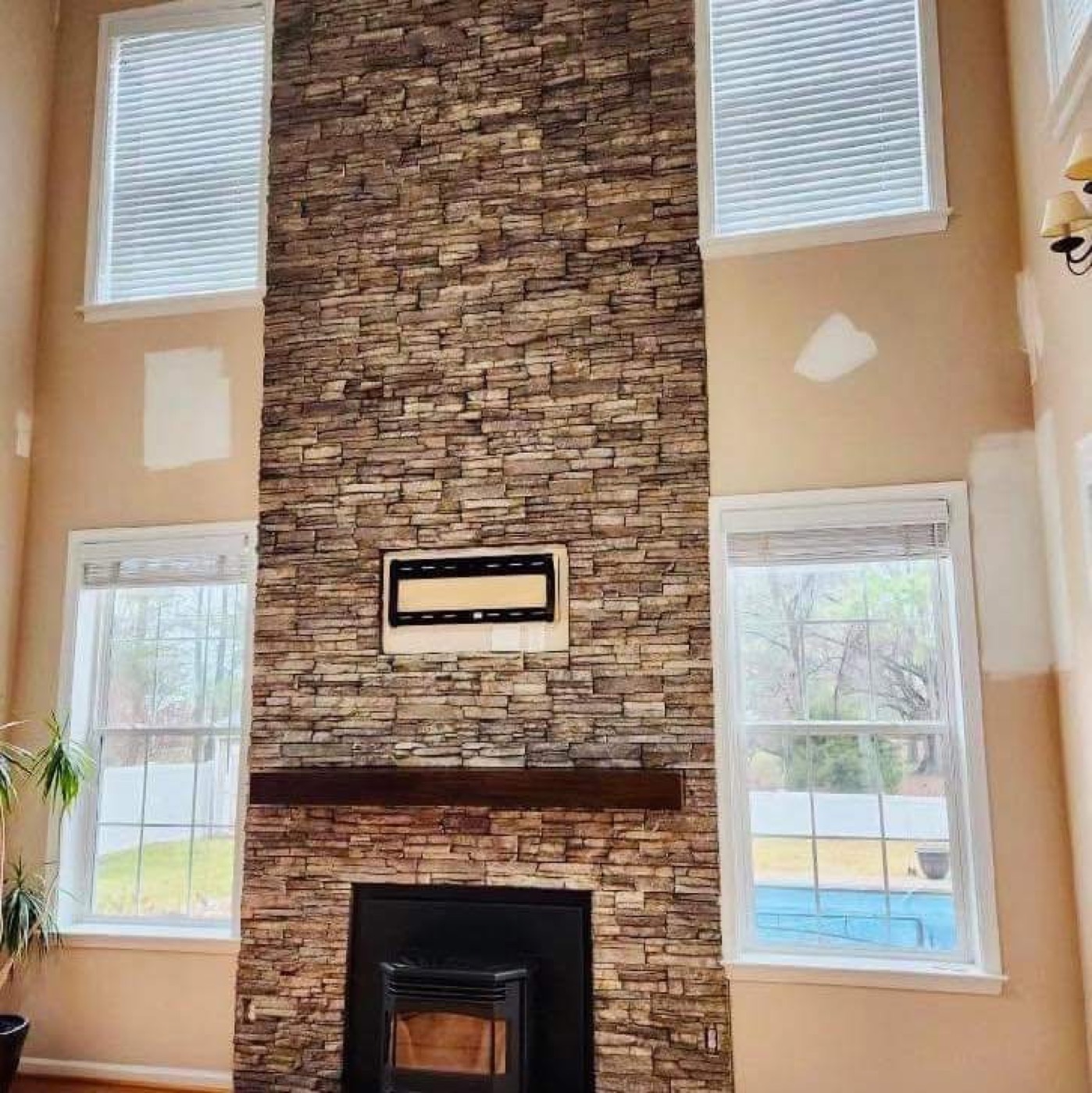 Two-story stone fireplace surround
