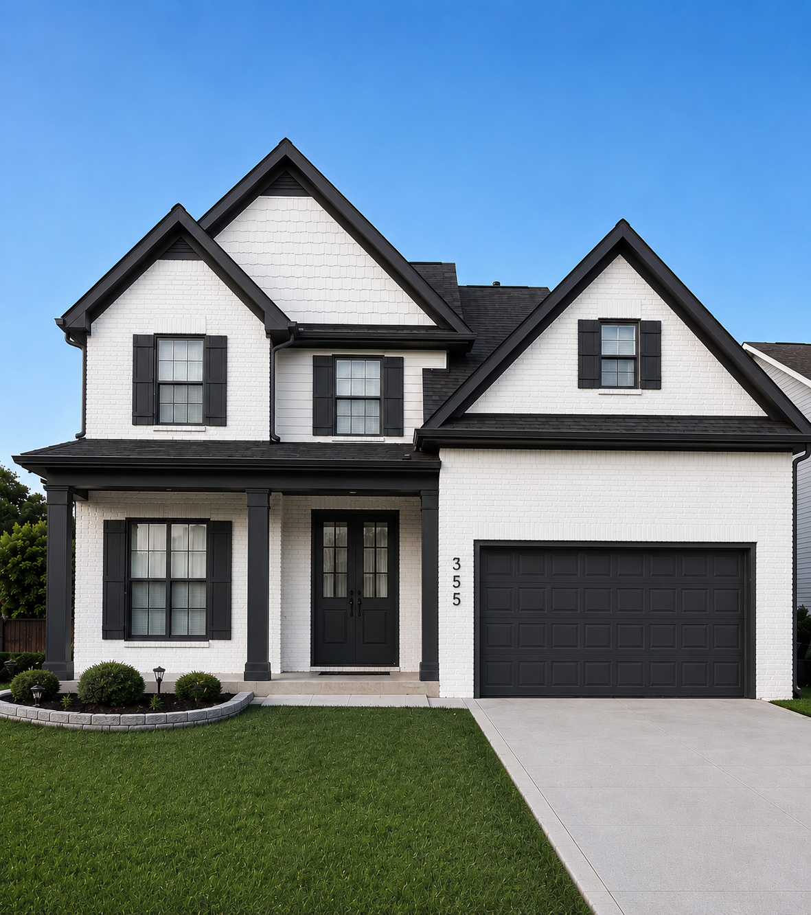 Fresh black and white exterior house painting with clean trim